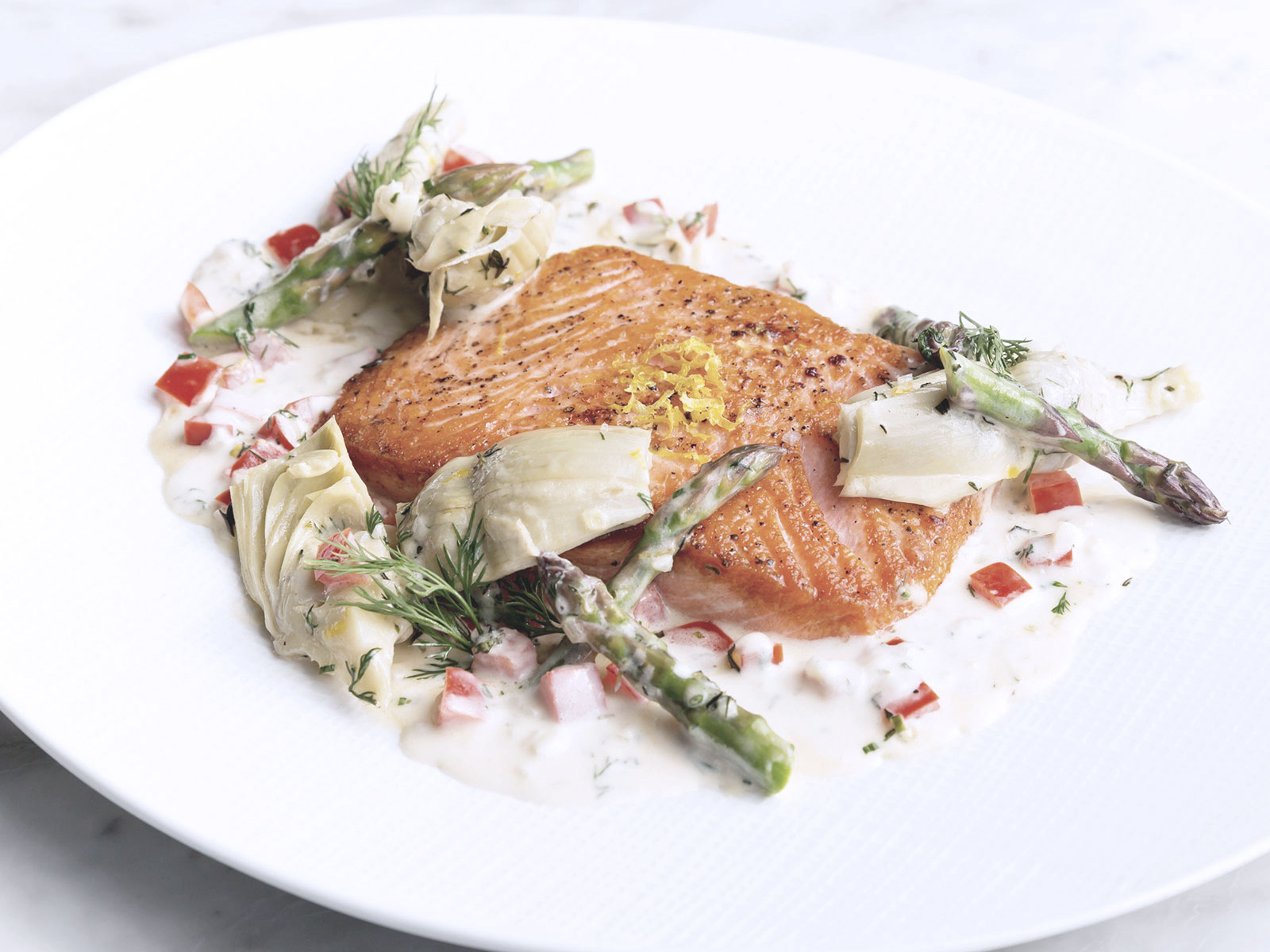 Salmon with celery sauce and spring asparagus
